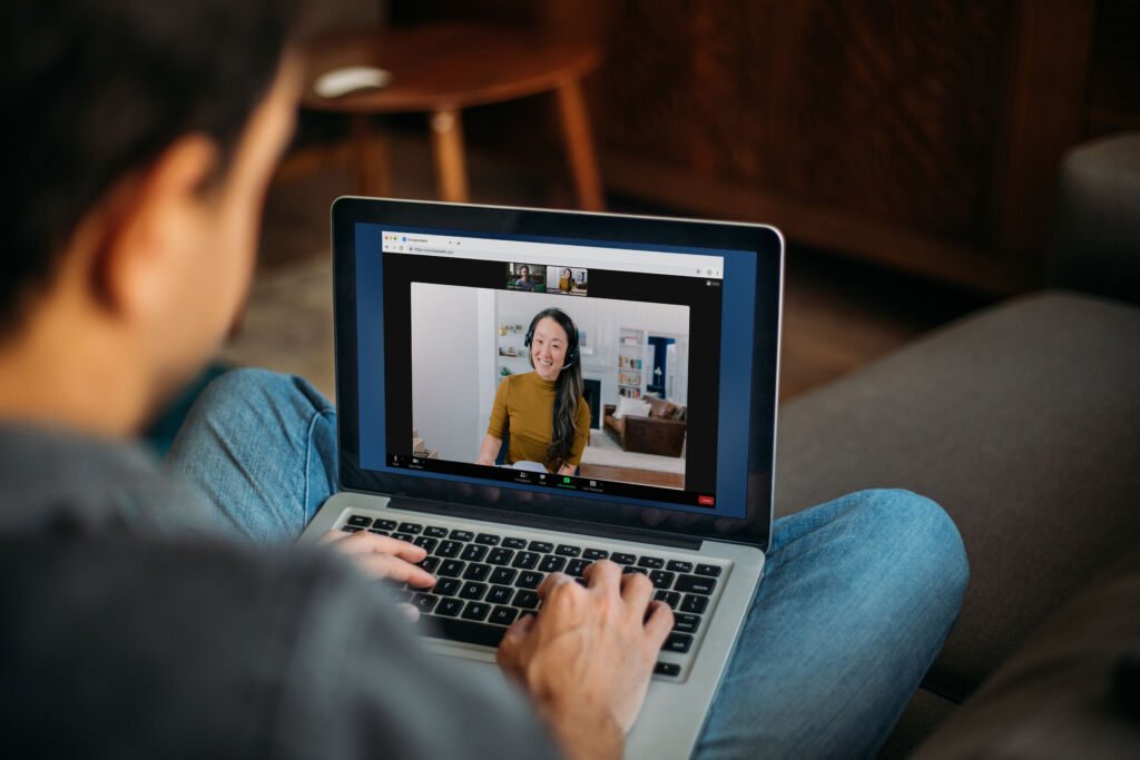 Man Using Laptop Blank Screen at Home